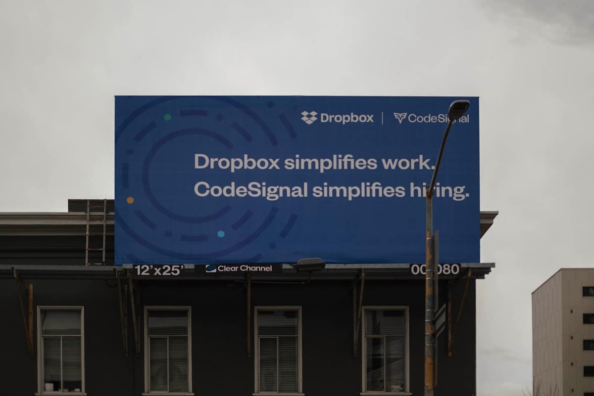 Dropbox and codesignal billboard simplifies work and hiring.